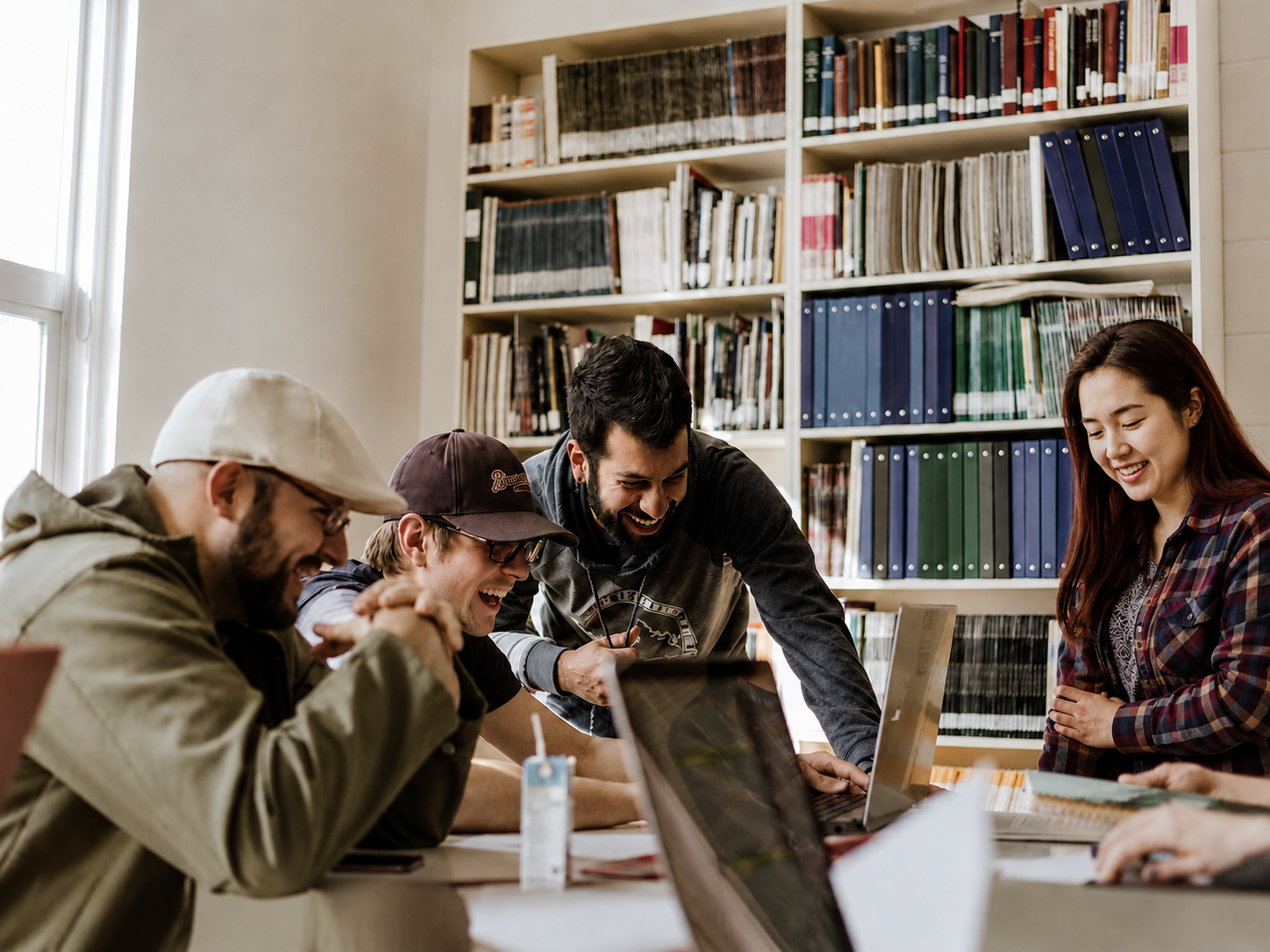 International students studying together in a library